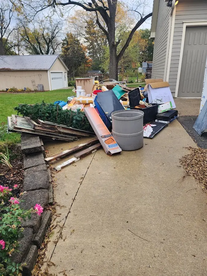 Dumpster being loaded with debris for Residential Dumpster Rental in Barkhamsted